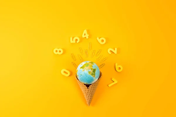 Top View Earth Globe Waffle Cone Surrounded Digits Yellow — стоковое фото