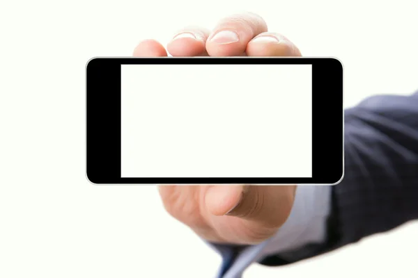 Рукой придерживая смартфон с пустой экран — стоковое фото