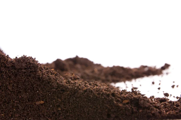 Раздел почвы или грязи, изолированные на белом фоне — стоковое фото