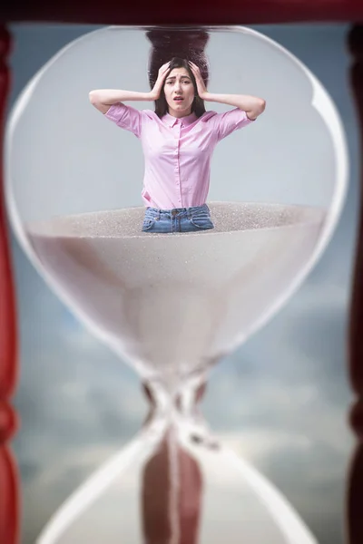 Sad Woman Stands Hourglass Closeup Deadline Concept — стоковое фото