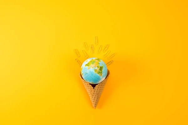 Top View Earth Globe Waffle Cone Paper Clips Yellow — стоковое фото