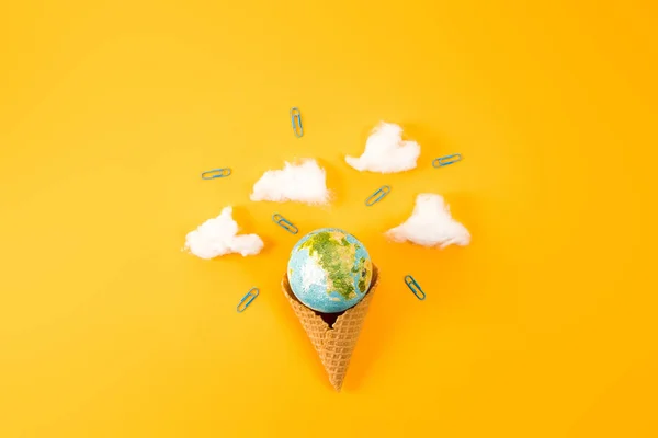 Top View Earth Globe Waffle Cone Clouds Made Cotton Yellow — стоковое фото