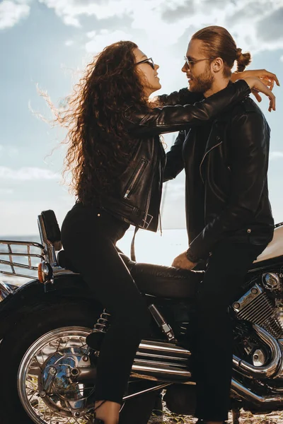 Couple Bikers Black Leather Jackets Hugging Chopper Motorcycle — стоковое фото